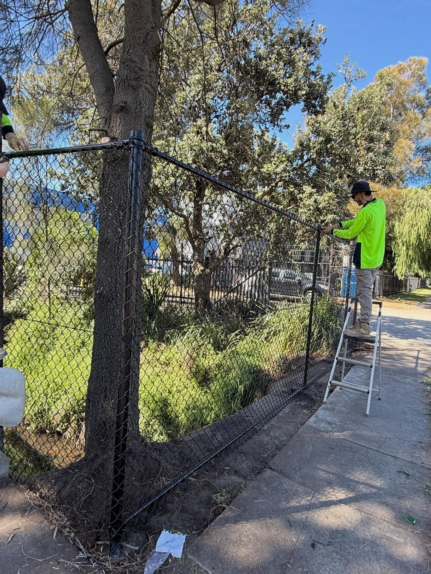 Installation of Chain Wire Fencing 2.1 H Black  in NSW