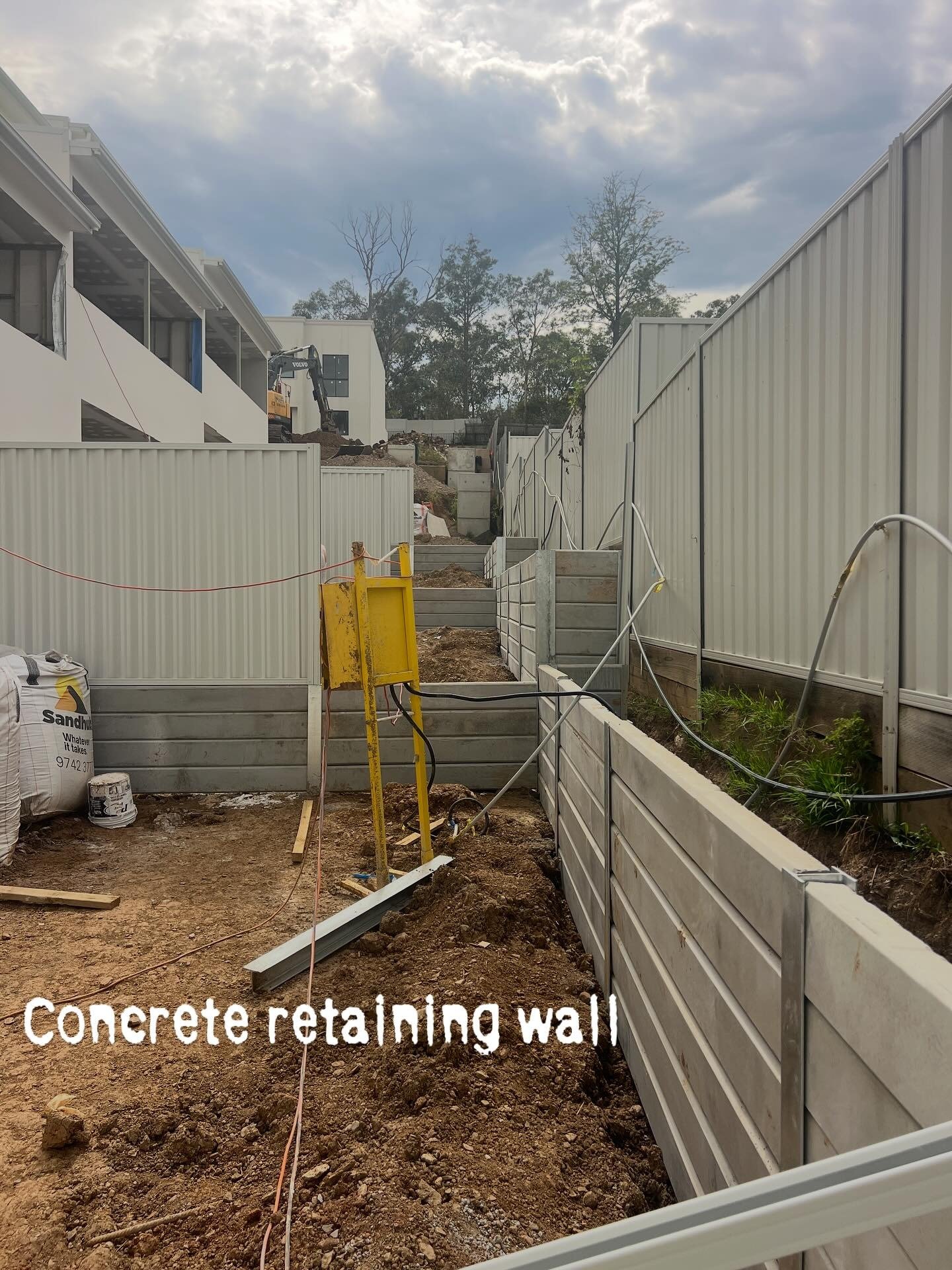 Concrete retaining wall installed by True Fence in NSW