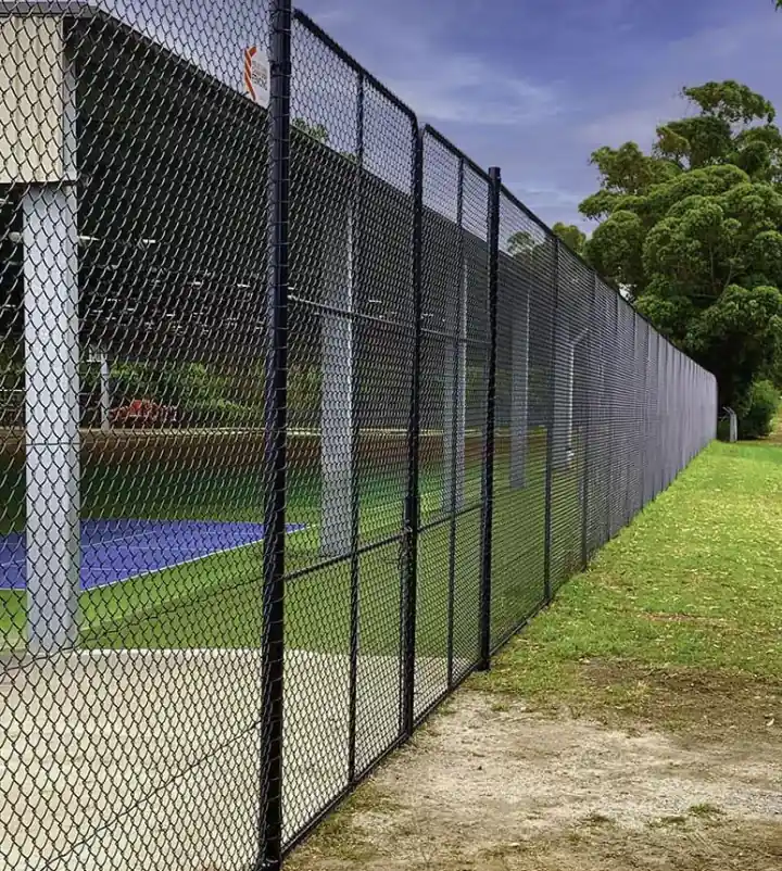 Black chain wire fence around a sports court